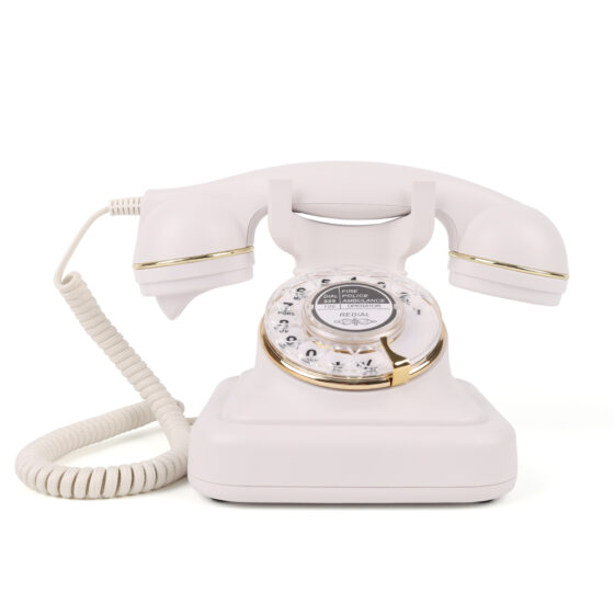 Antique Communication Telephone with white rotary dial and gold trim for wired setups.