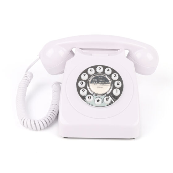 Angled view of Western Style Push Button Telephone CT-8019 in white, featuring a classic rotary dial and push-button design. Angled view of Western Style Push Button Telephone CT-8019 in white, featuring a classic rotary dial and push-button design.
