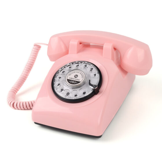 Teléfono de audio giratorio americano vintage CT-8019, pink retro rotary landline with audio function, classic American design for home and office decor.
