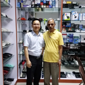 Team leader welcomes international visitor in factory showroom